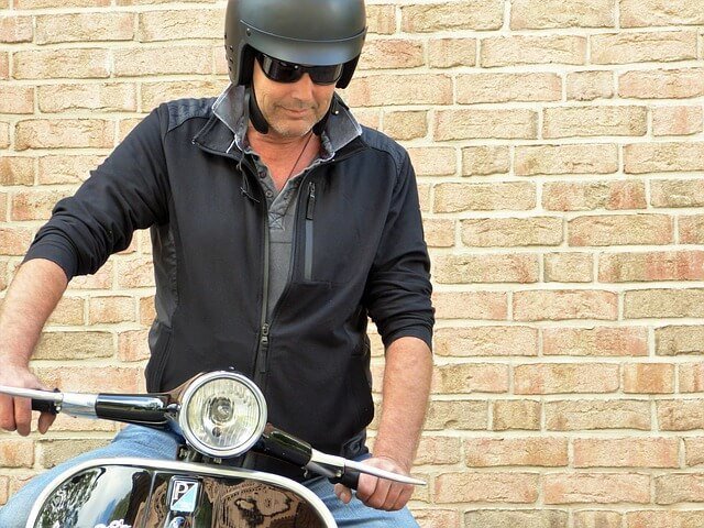 man wearing a scooter helmet